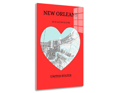 Map of New Orleans in heart shape showing city streets and coordinates 29°57'45"N 90°03'50"W on red background with text "NEW ORLEANS" and "UNITED STATES".
