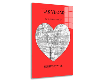 Las Vegas city map depicted as a white heart on a red background, with the city's street grid visible inside the heart shape and geographic coordinates provided below the title "Las Vegas".
