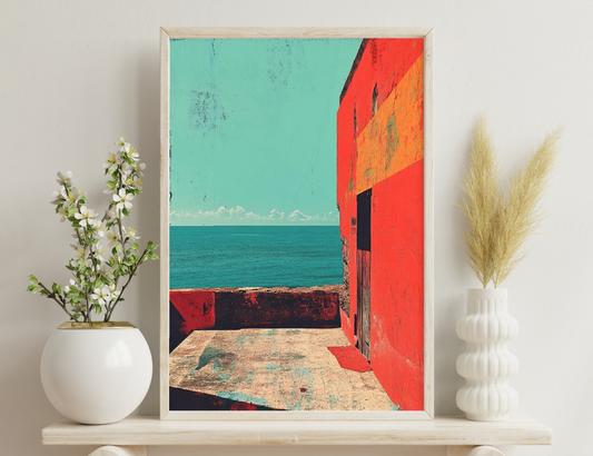 A colorful seaside scene with a vibrant red building wall contrasting against the turquoise ocean and sky, creating a striking visual composition with textures and geometric shapes.
