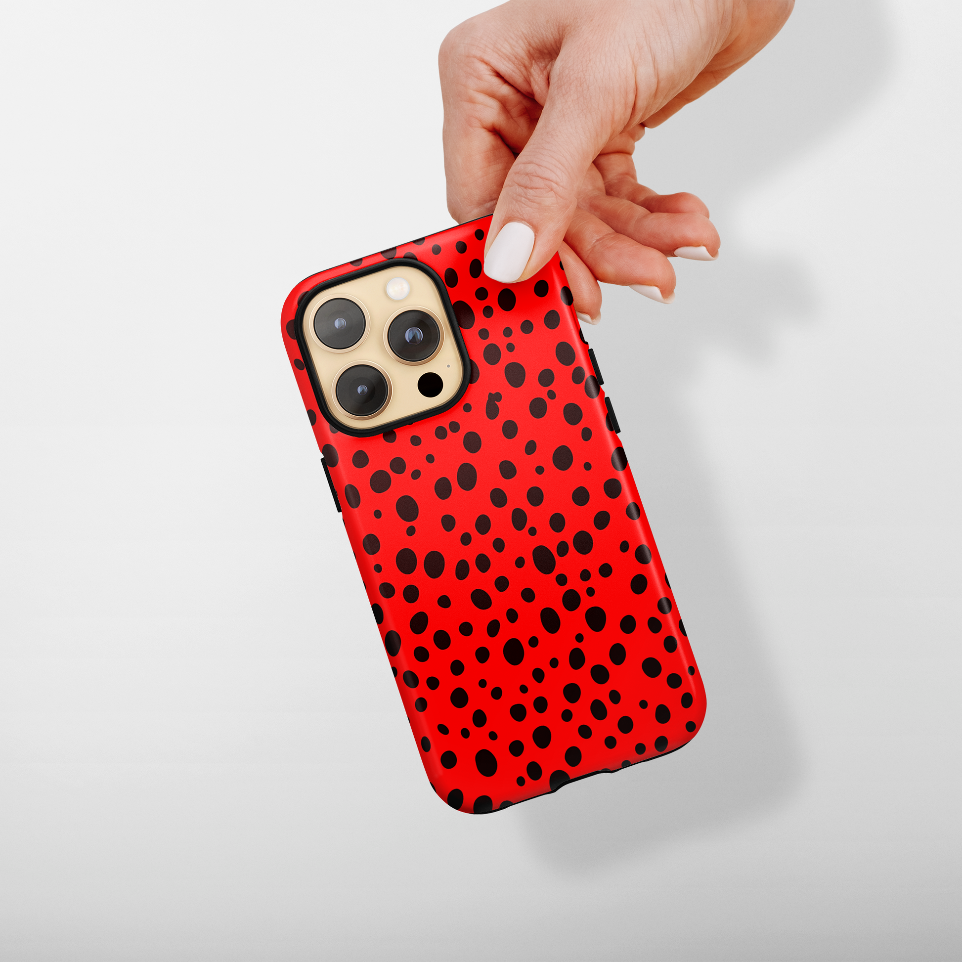 Dotted Delight - Red (iPhone Case 11-15)Elevate your iPhone's style with Rima's Red backdrop with varied black dots case. Sleek, durable protection for models 11-15. Free US shipping.RimaGallery