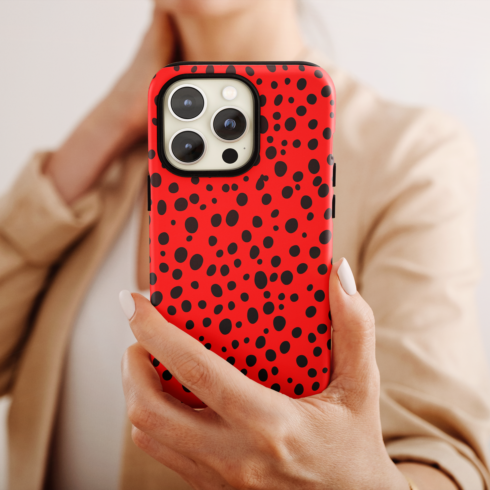 Dotted Delight - Red (iPhone Case 11-15)Elevate your iPhone's style with Rima's Red backdrop with varied black dots case. Sleek, durable protection for models 11-15. Free US shipping.RimaGallery