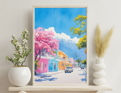 A colorful painting depicts a vibrant street scene with pastel-colored buildings, blooming trees in pink and yellow, and a snow-capped mountain in the background under a blue sky with white clouds.
