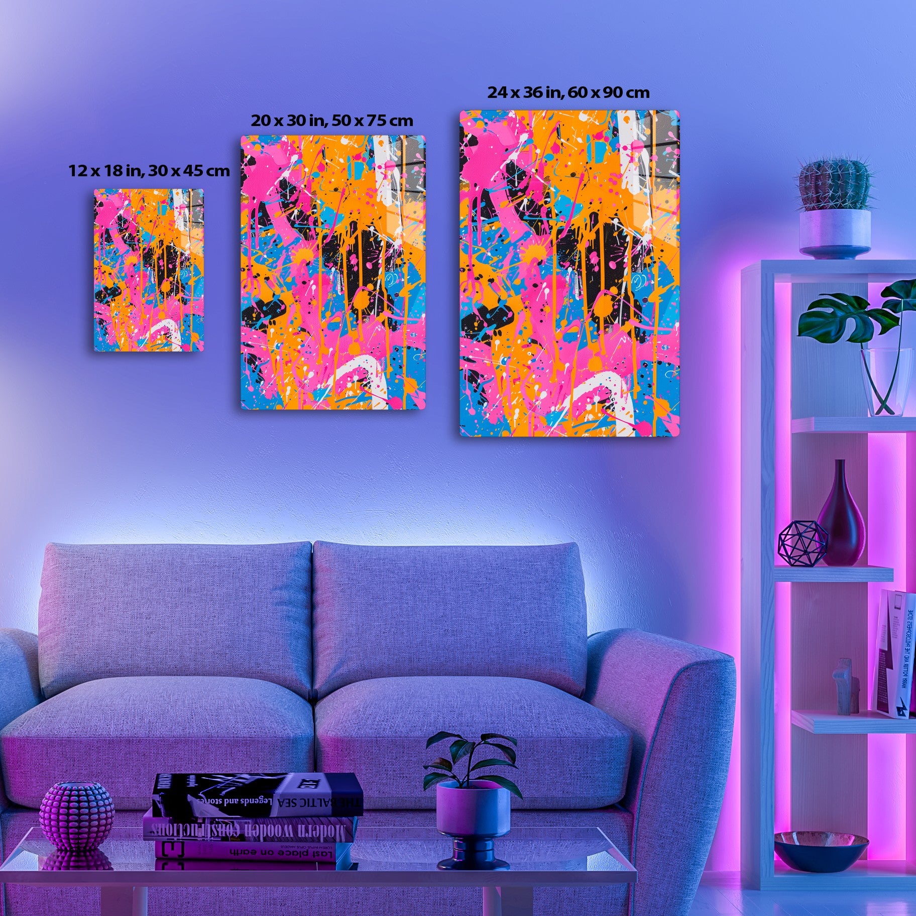 Abstract splatter art in vibrant pink, orange, blue, and black colors. Bold brushstrokes and drip patterns create a lively, energetic composition.
