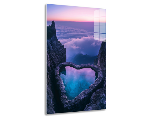 Heart-shaped blue lake surrounded by rocky cliffs at sunrise, with clouds filling the valley below providing a dreamlike scene.
