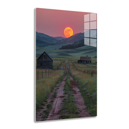 A dirt path leads through a grassy meadow with wildflowers towards old wooden barns, surrounded by mountains and a massive orange moon rising in the twilight sky.
