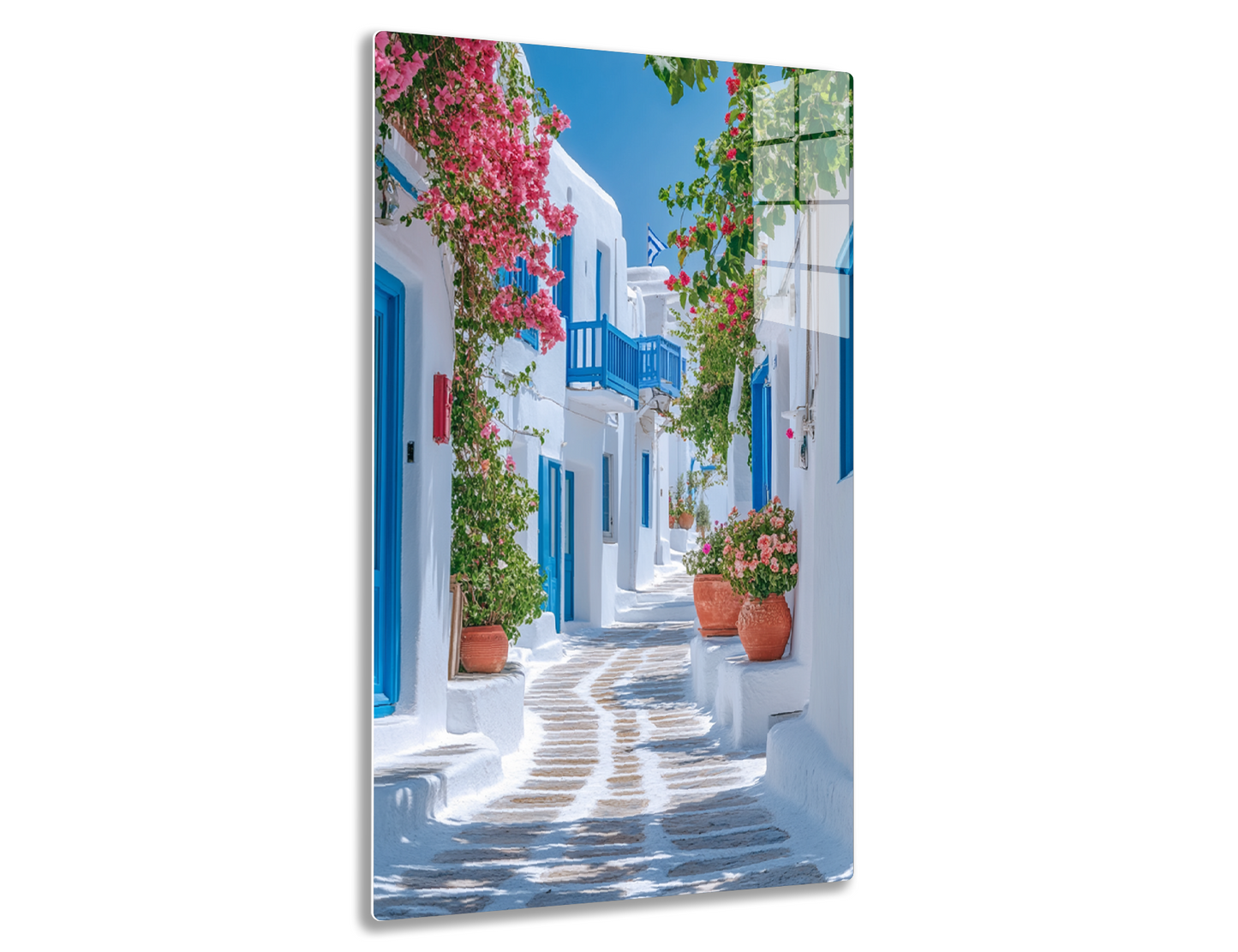 A picturesque alleyway in a Greek island town, with whitewashed buildings, blue doors and windows, and vibrant bougainvillea flowers adorning the walls and balconies along the cobblestone path.
