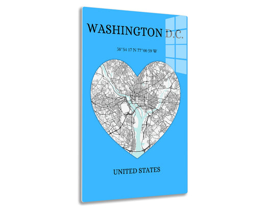 Map of Washington D.C. in the shape of a heart showing roads and waterways on a blue background, with the geographic coordinates and "United States" text below the map.
